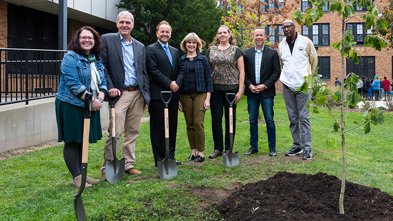 Photo of a group of people planting a tree